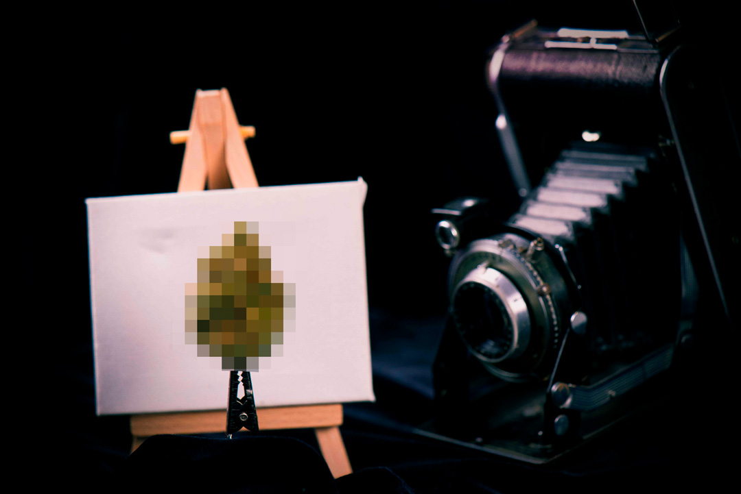 censorship-stories-image of camera photographic cannabis bud in front of canvas on easel, pixelated bud - AdobeStock_123509573